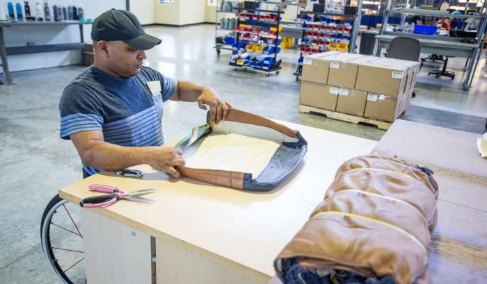 Relay Resources Offers Work to People with Barriers to Employment. Seen here deconstructing leather seats.